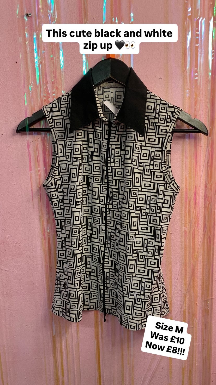 Black and white zip up sleeveless top