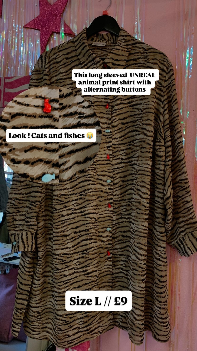 Animal print long sleeved top with novelty buttons size M (16)